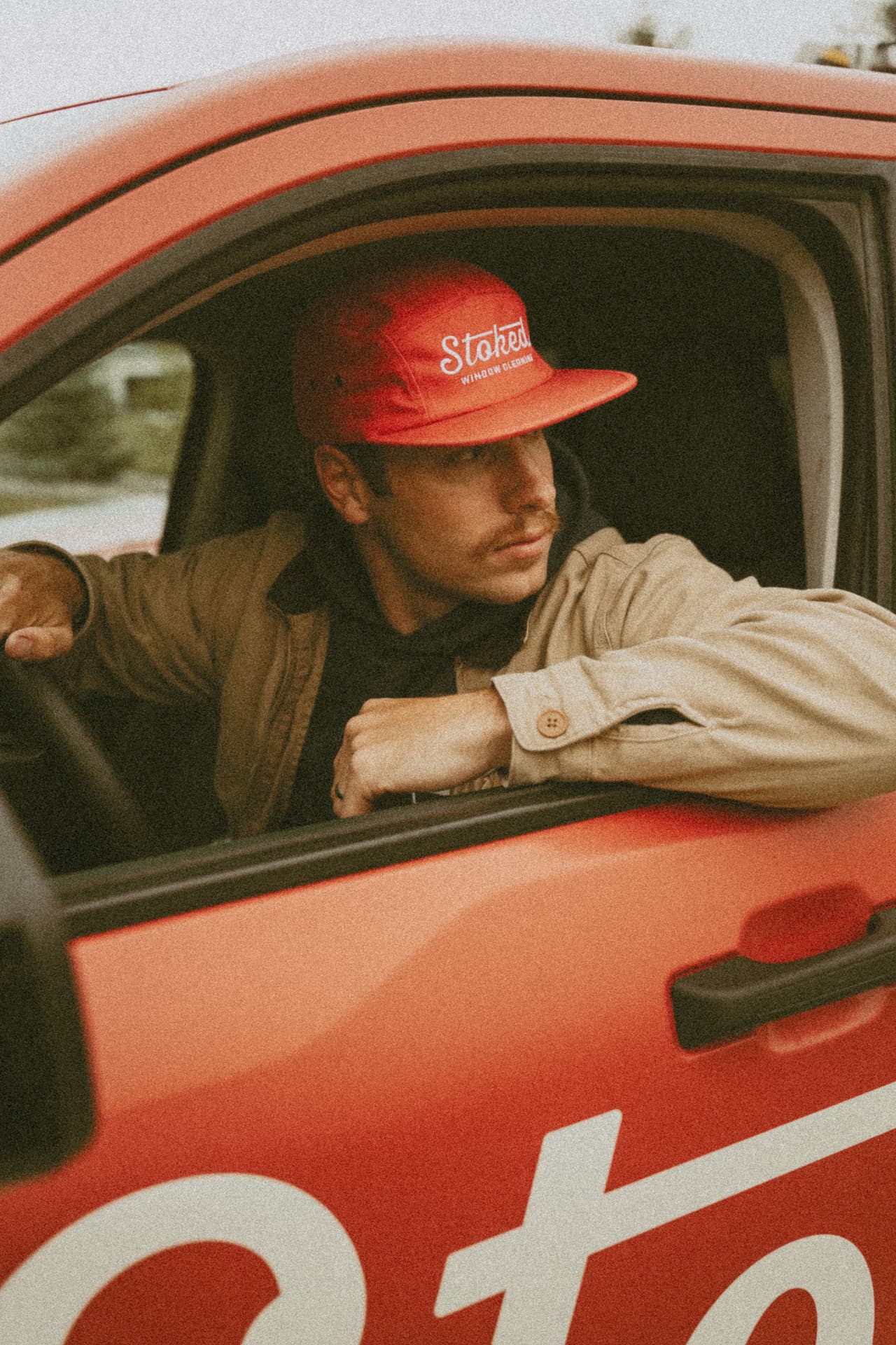 Parker Boyle, founder of Stoked Window Cleaning, in the company truck