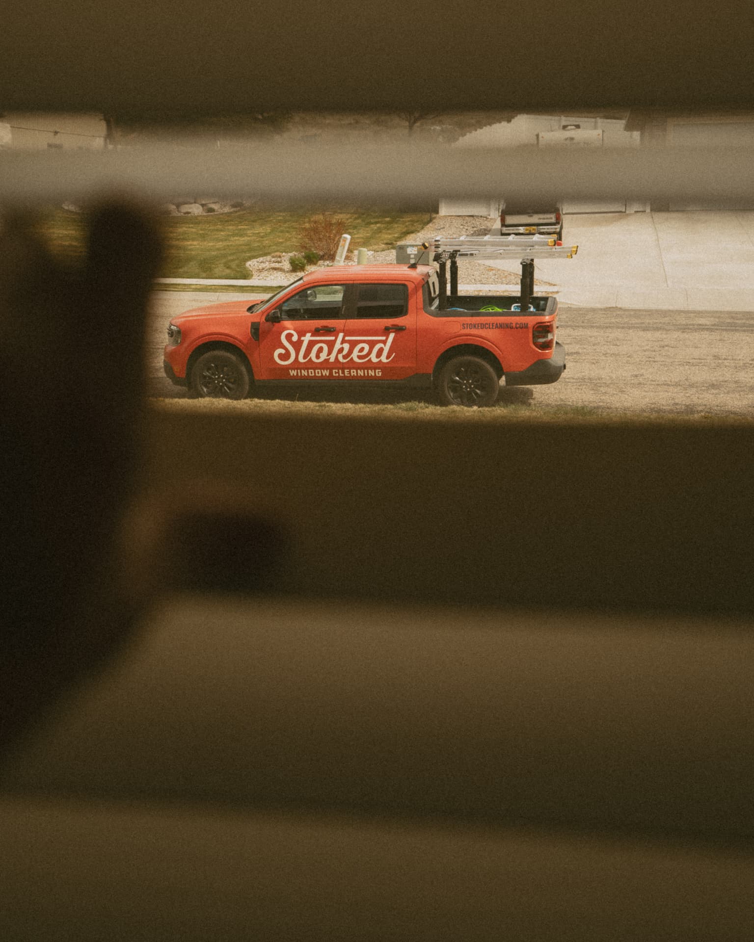 Stoked Window Cleaning van parked at an Eastern Idaho home